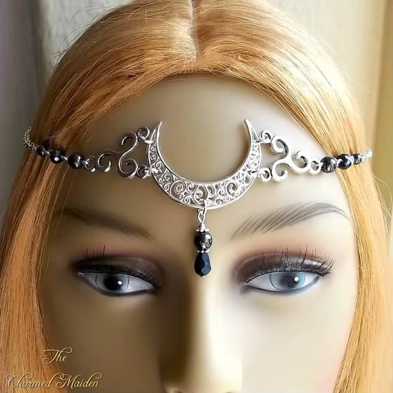 Wicca moon and triskele headpiece with gothic design, perfect for pagan rituals and wedding ceremonies, featuring intricate metal details.