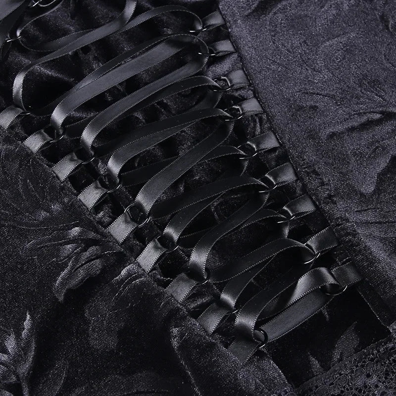 Black velvet Y2K goth crop top with lace trim, sleeveless backless strap design, perfect for emo and alternative fashion.