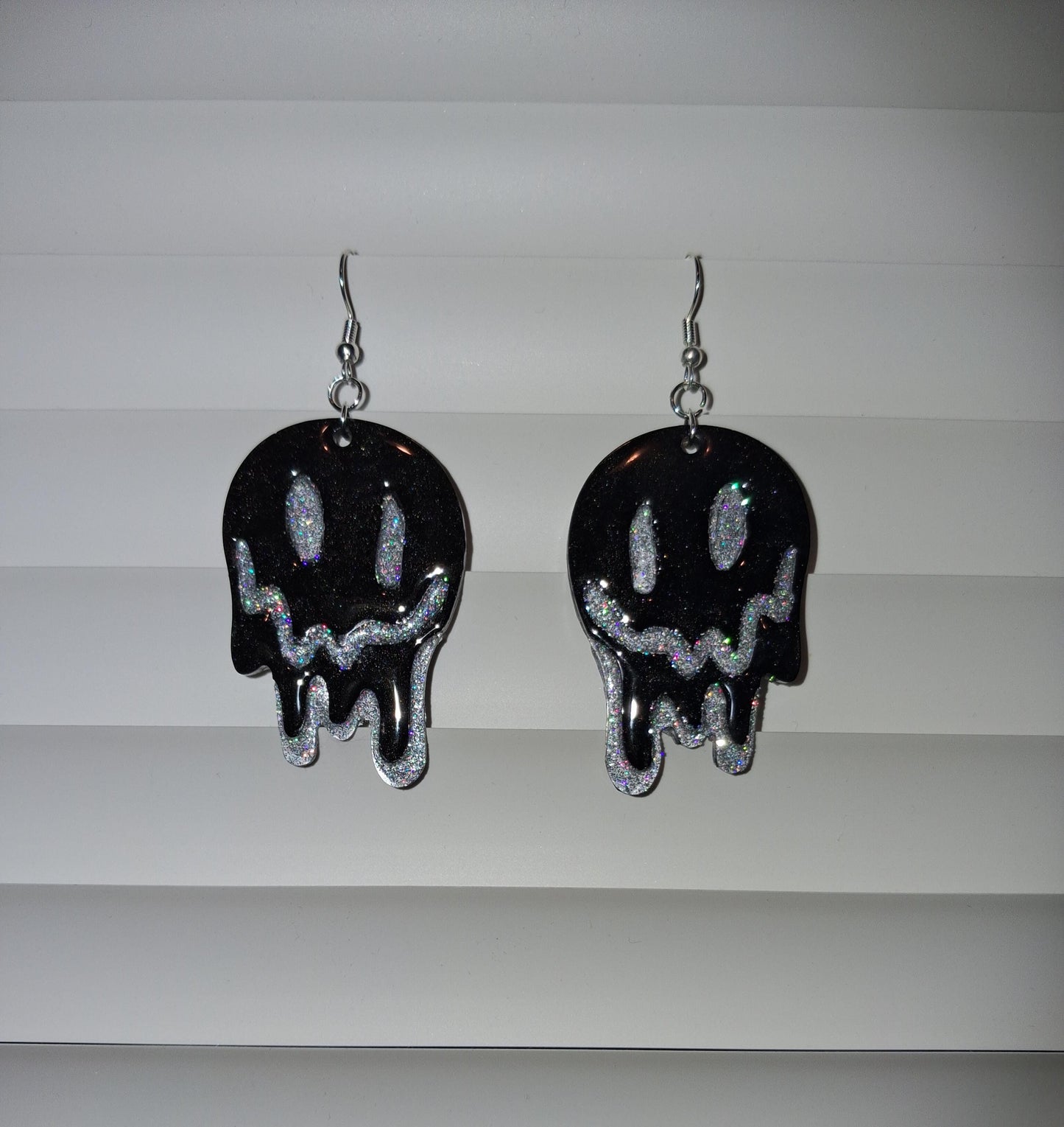 Yellow melting smiley face earrings with glittery dripping design, trendy Y2K jewelry, hypoallergenic statement accessory.