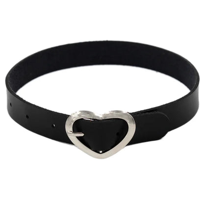 Black leather choker necklace with edgy metal spikes, gothic punk jewelry suitable for parties and festivals.