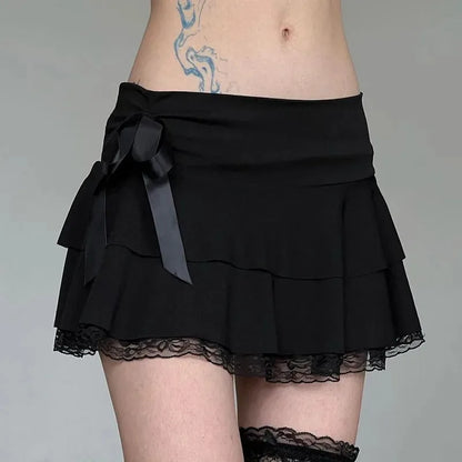 Black lace trim Y2K goth mini skirt for women featuring bow detail and A-line silhouette, Korean streetwear fashion by PressureDen.store.