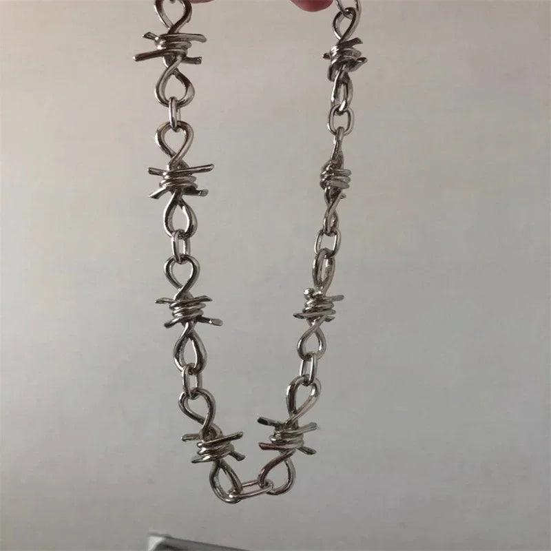 Vintage punk barbed wire choker necklace with edgy goth style, featuring black metal and detailed chain design.