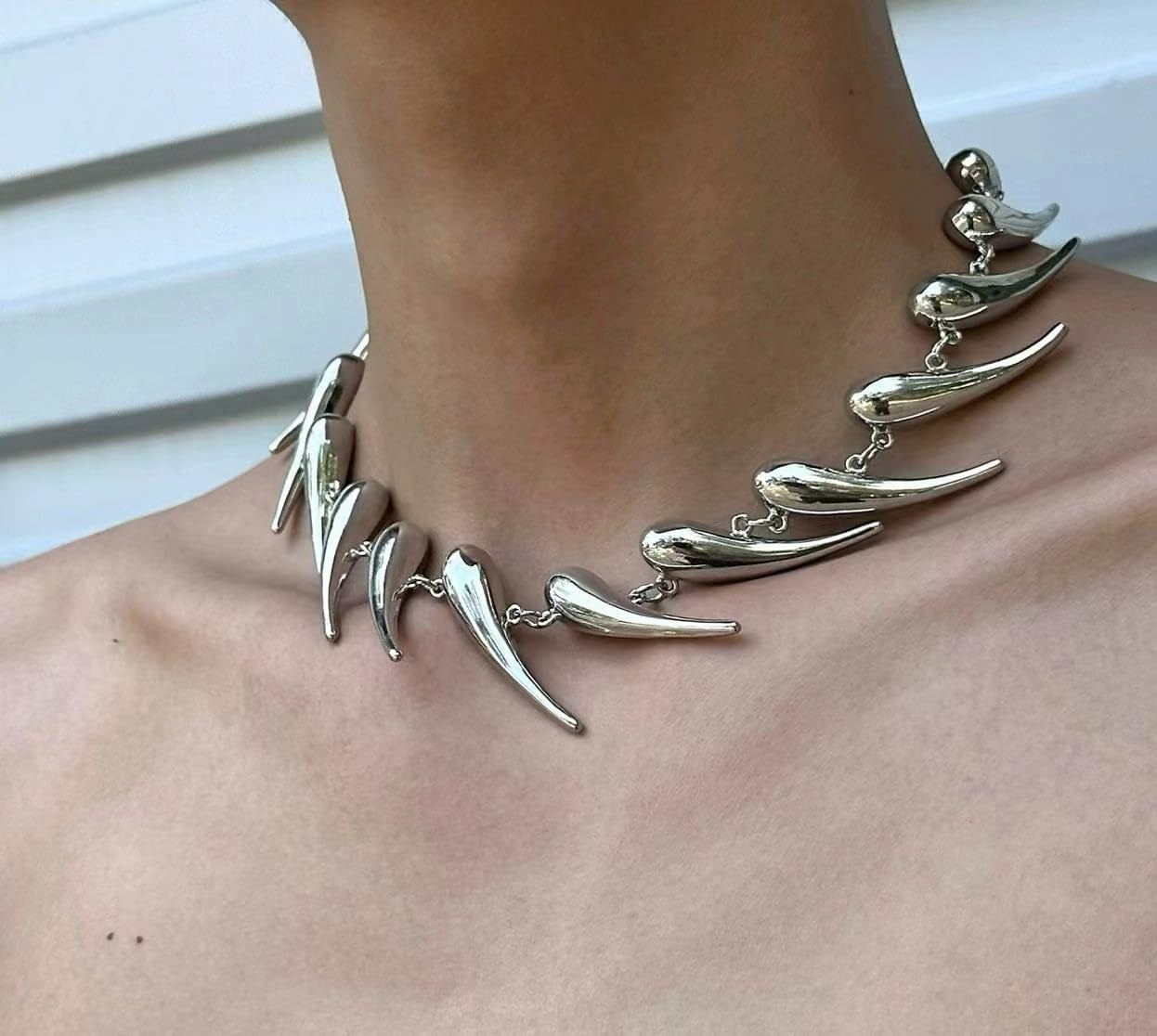 Handmade silver spike choker necklace with adjustable punk goth design, featuring edgy metal spikes on a sleek collar.