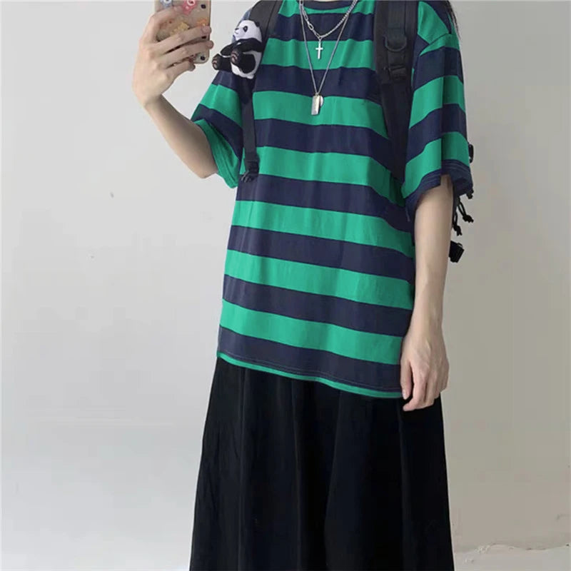 Black and white striped oversized goth punk T-shirt for women with Harajuku and hip hop style, featuring bold print and loose fit.