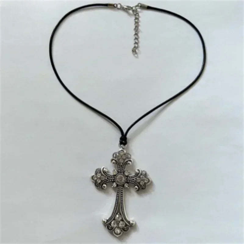 Rhinestone cross choker necklace with spiral design, gothic punk style jewelry for women, featuring shimmering stones and bold fashion statement.