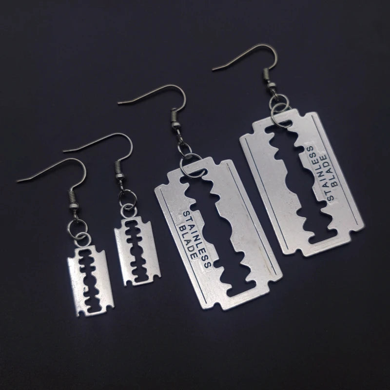 Edgy razor blade earrings for men and women featuring a 90s grunge goth punk aesthetic, jewelry from PressureDen.store