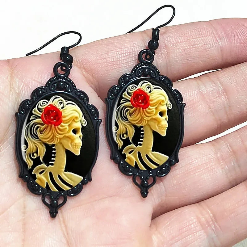 Gothic witch cameo dangle earrings with vintage crystal glass accents and Victorian punk style jewelry design.