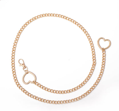 Vintage heart waist chain by FNQUFUJ, adjustable body jewelry draped over a dress, featuring a charming heart pendant and chain details.