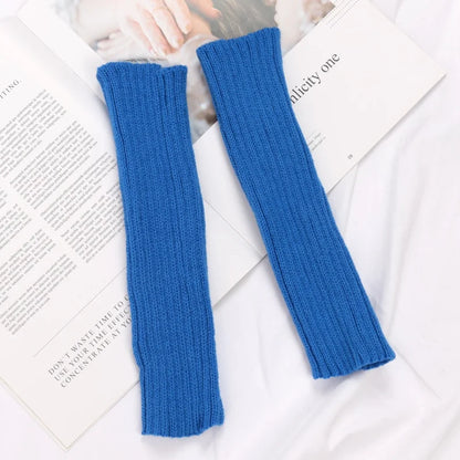 Black long fingerless gloves for women, cozy winter arm sleeves with goth and punk style, made by PressureDen.store.