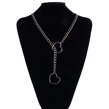 Stylish heart slip chain choker necklace, punk rock goth jewelry for women with a bold heart pendant and layered chain design.
