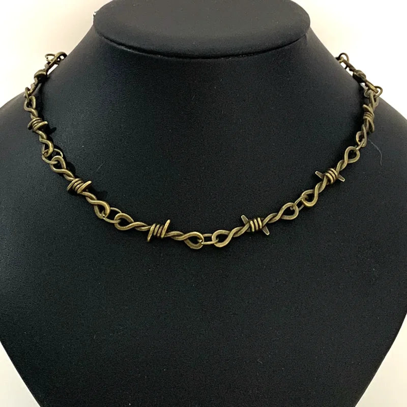 Gothic heart choker necklace with barbed wire design, hip-hop inspired jewelry for women, featuring edgy, bold style.