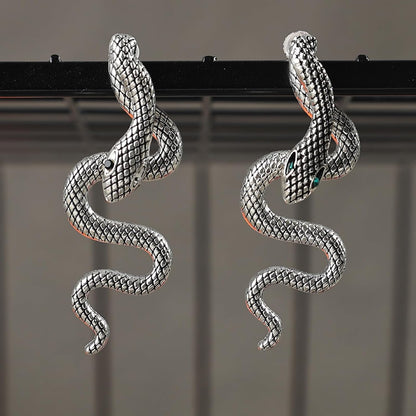 Vintage gothic snake earrings by JSLOVFLO featuring gold and silver design, perfect for Halloween and statement jewelry.