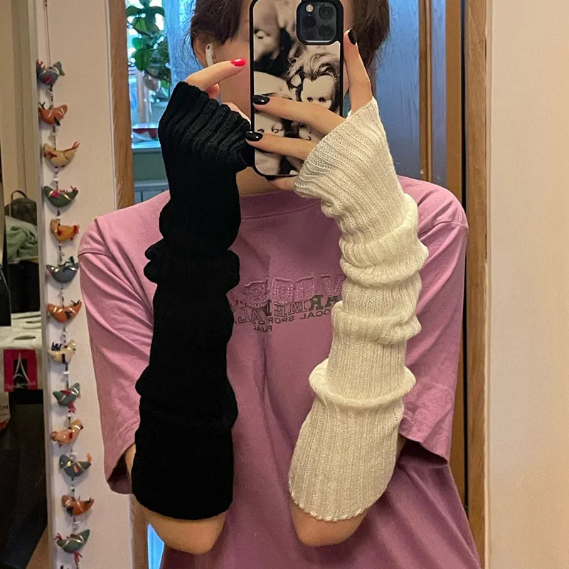 Chic long fingerless gloves for women, soft knitted winter arm warmers in casual gothic punk style with a cozy, stylish look.