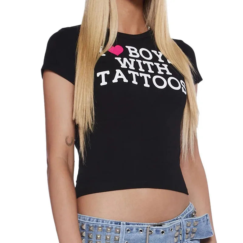 Black goth graphic crop top featuring 2000s Y2K Harajuku style with bold prints, ideal for e-girl and aesthetic fashion looks.