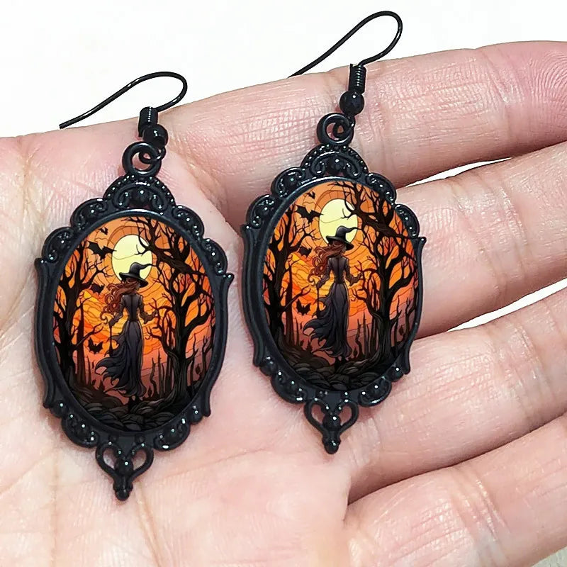 Gothic witch cameo dangle earrings with vintage crystal glass accents and Victorian punk style jewelry design.