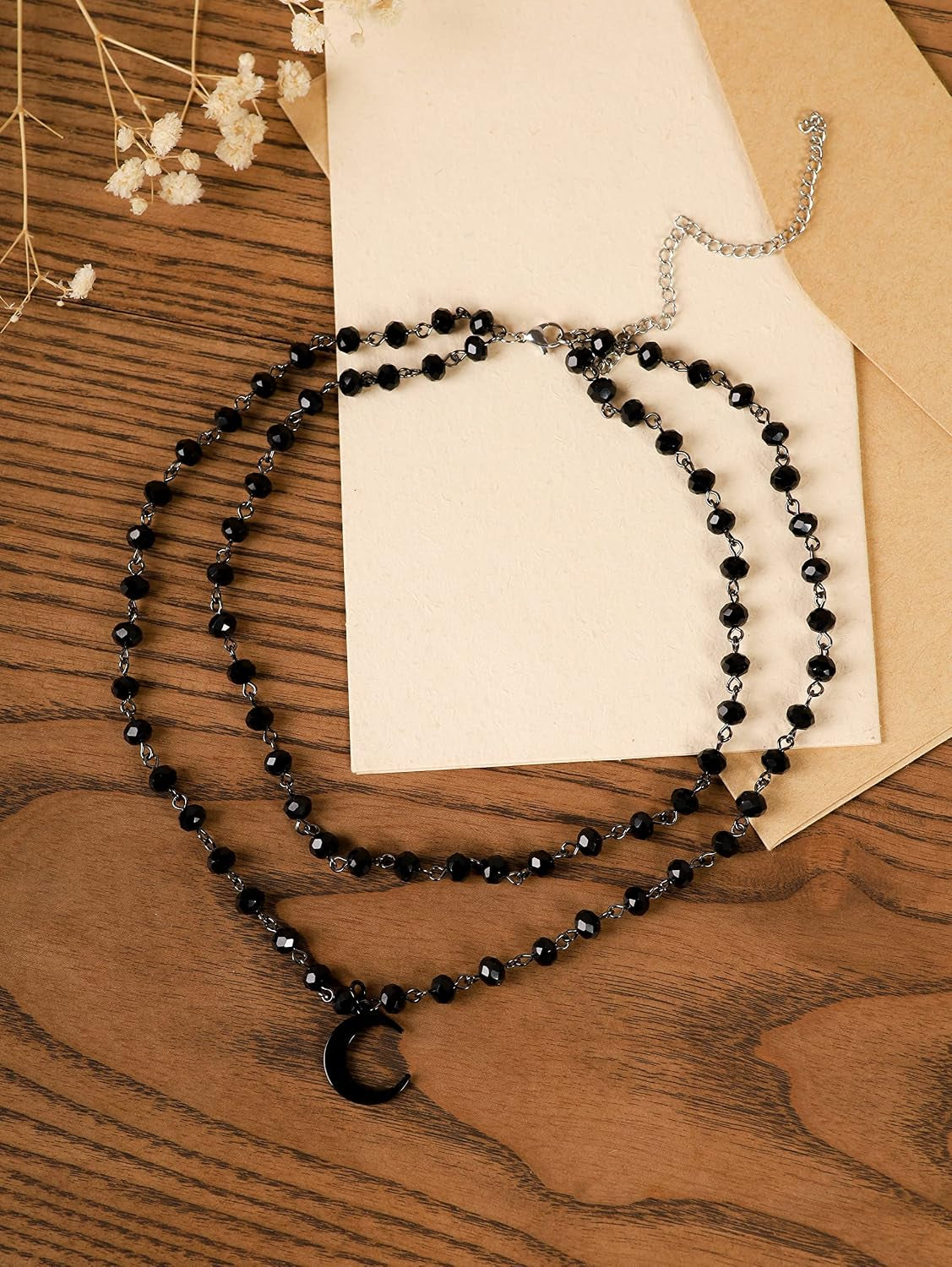 Gothic black layered crescent moon choker necklace by Sacina, featuring intricate design, perfect for a stylish layered look.