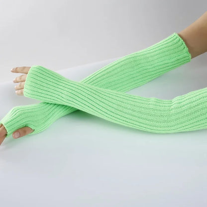 Chic long fingerless gloves for women, cozy knitted winter arm warmers in soft gothic punk style, casual and stylish accessory.