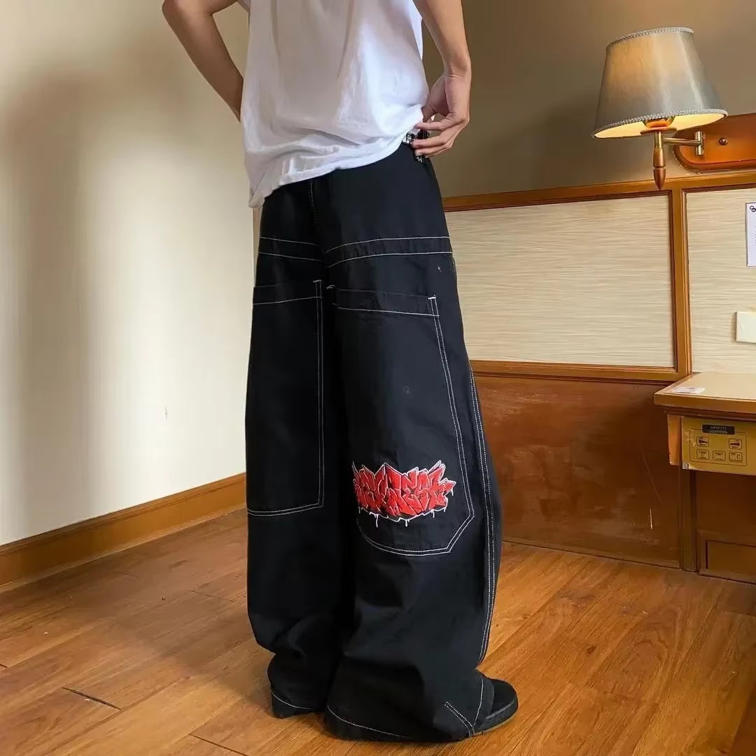 High waist Y2K Harajuku baggy jeans with retro wing embroidery, gothic wide trousers, stylish and trendy.
