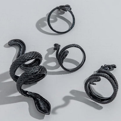 Set of three adjustable black snake rings by ONBRIG, vintage gothic punk jewelry for women featuring snake designs.