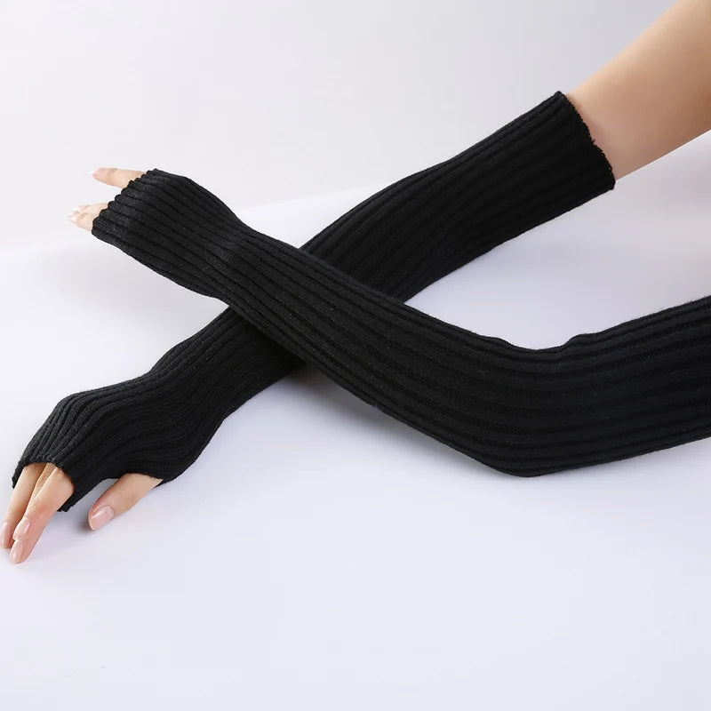 Pair of black knitted fingerless gloves for women, stylish winter warmer arm sleeves with casual gothic punk style from PressureDen.store