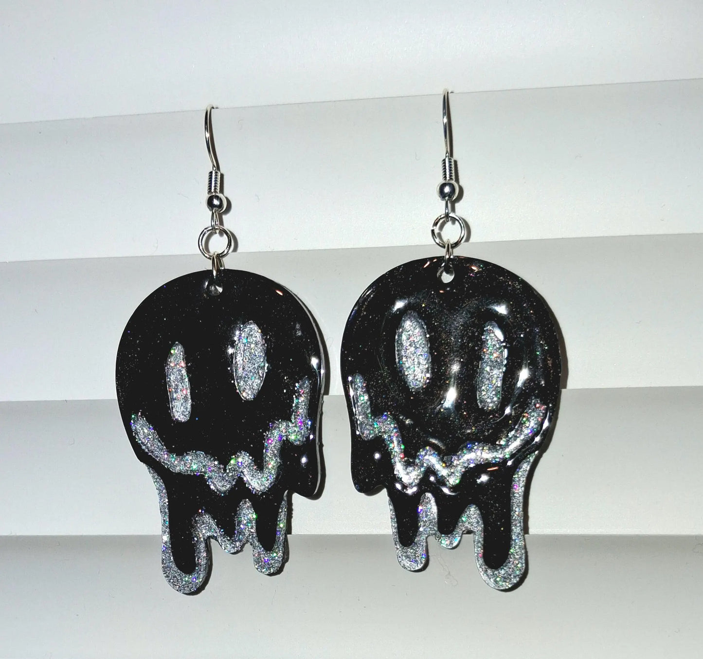Melting smiley face earrings with dripping glitter design, trendy Y2K jewelry style, made for a happy, hypoallergenic look.