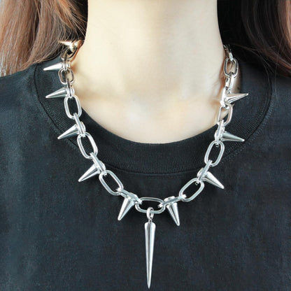 Silver spiked choker necklace with rivet and chain details, unisex goth jewelry perfect for parties and nightclubs.