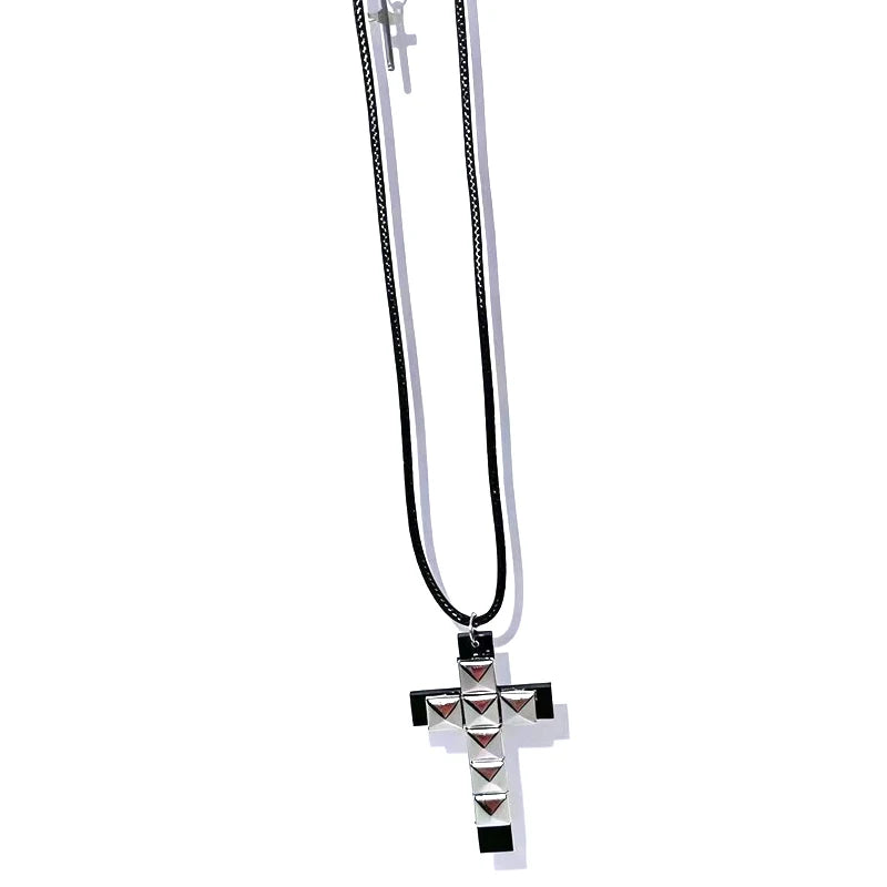 Edgy 90s punk rivet cross pendant necklace for women, grunge rock fashion accessory with metal rivets and gothic style.