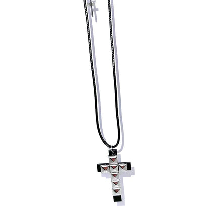 Edgy 90s punk rivet cross pendant necklace for women, grunge rock fashion accessory with metal rivets and gothic style.