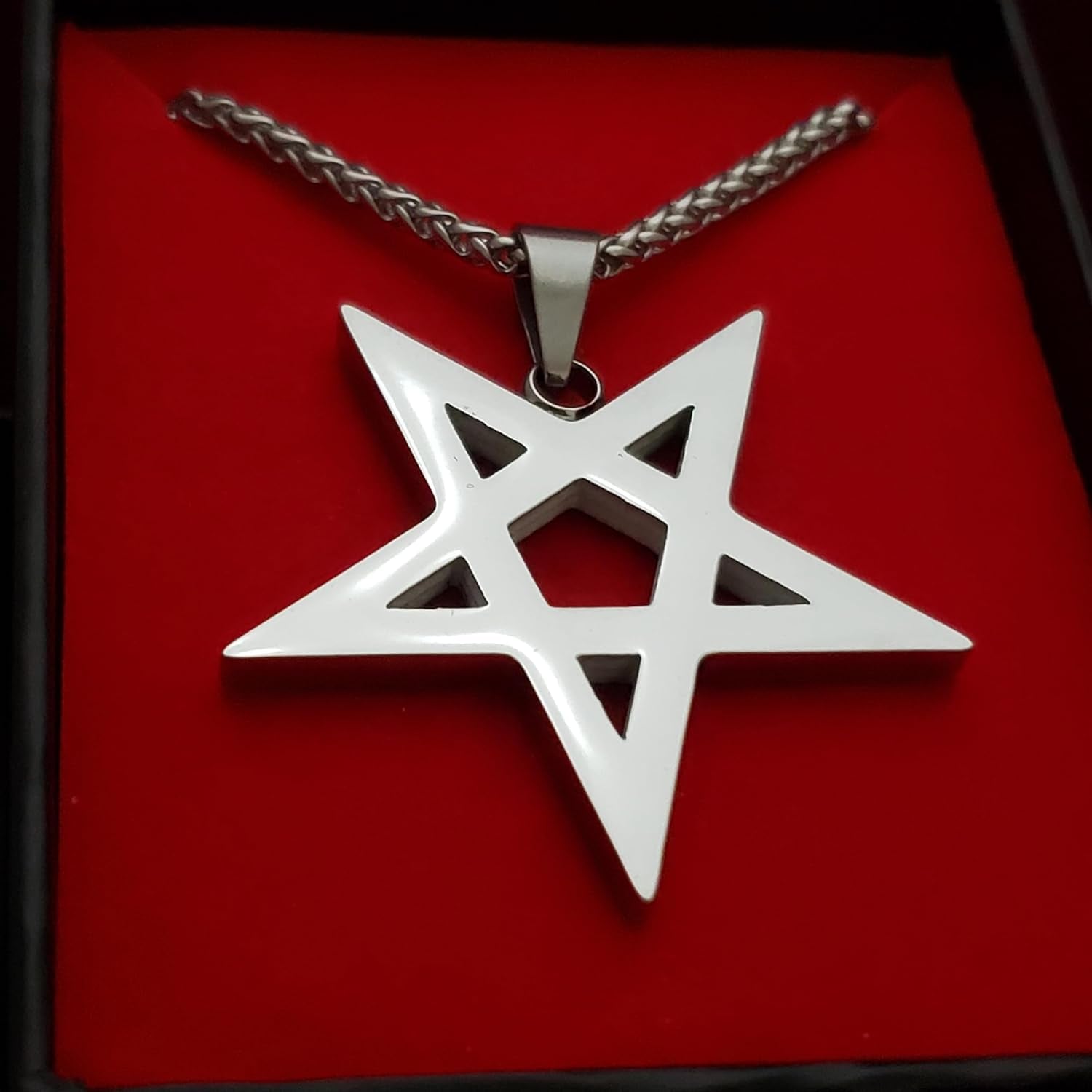 Black inverted pentagram pendant necklace featuring gothic occult design, perfect for witchcraft enthusiasts and gothic jewelry lovers.