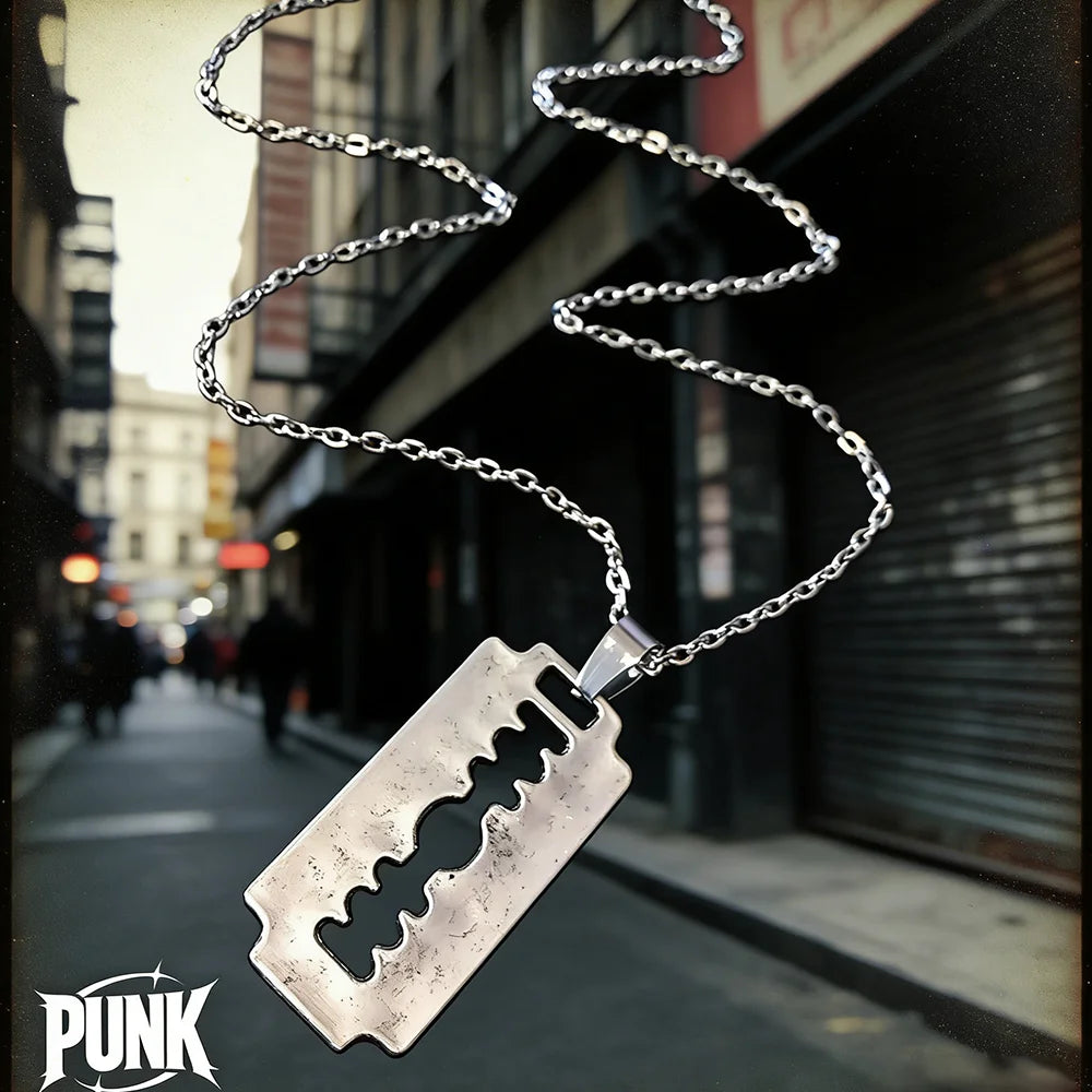 Y2K aesthetic razor blade pendant necklace with edgy vintage punk style, worn by men and women, featuring dark grunge jewelry design