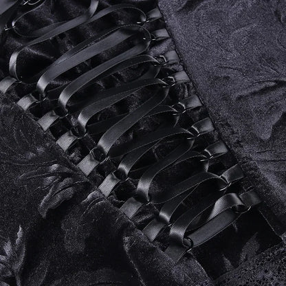Black velvet Y2K goth crop top with lace trim, sleeveless backless strap design, perfect for emo and alternative fashion.