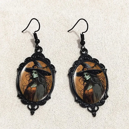 Gothic witch cameo dangle earrings with vintage crystal glass accents and Victorian punk style jewelry design.