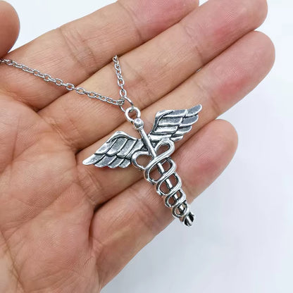 Y2K aesthetic razor blade pendant necklace by PressureDen.store, edgy vintage punk grunge jewelry for men and women.
