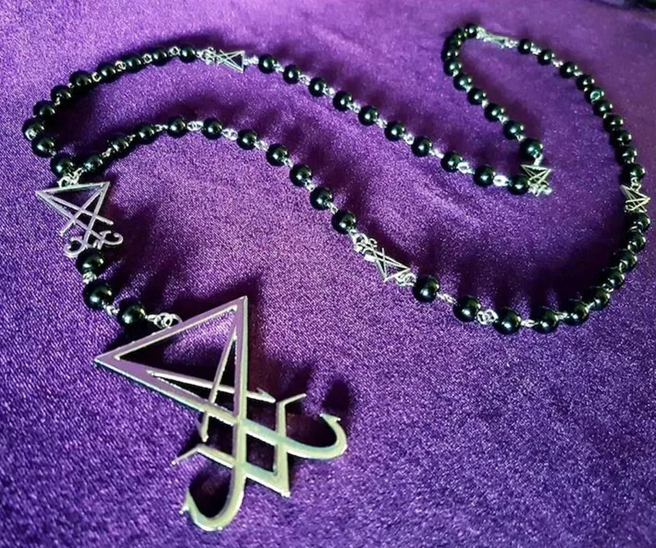 Luciferian Sigil Rosary Necklace featuring gothic occult design, black beads, and metal sigil pendant for left hand path spirituality.