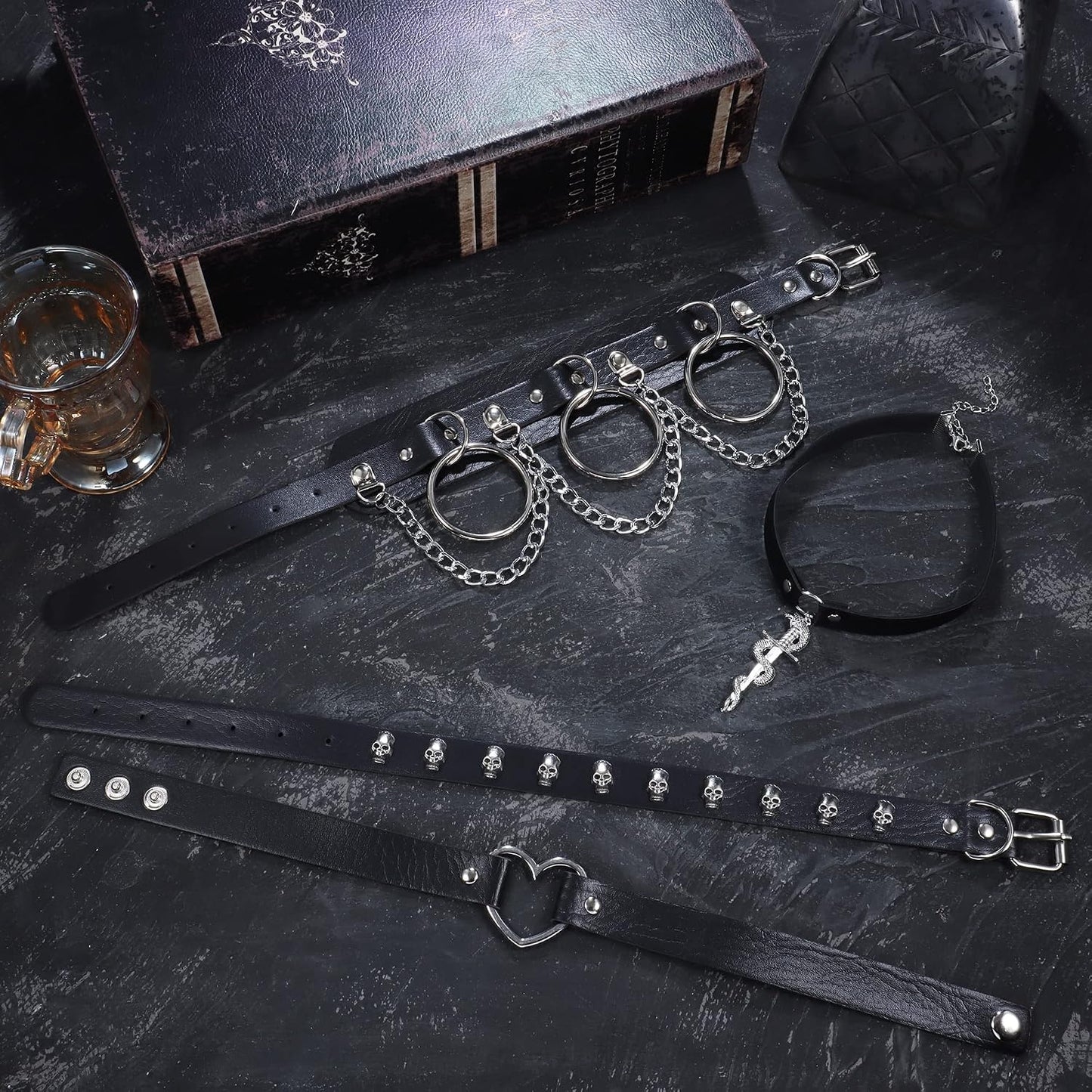 HAIAISO punk goth choker necklace set with 6-9 adjustable black PU collars featuring heart spikes for bold women.