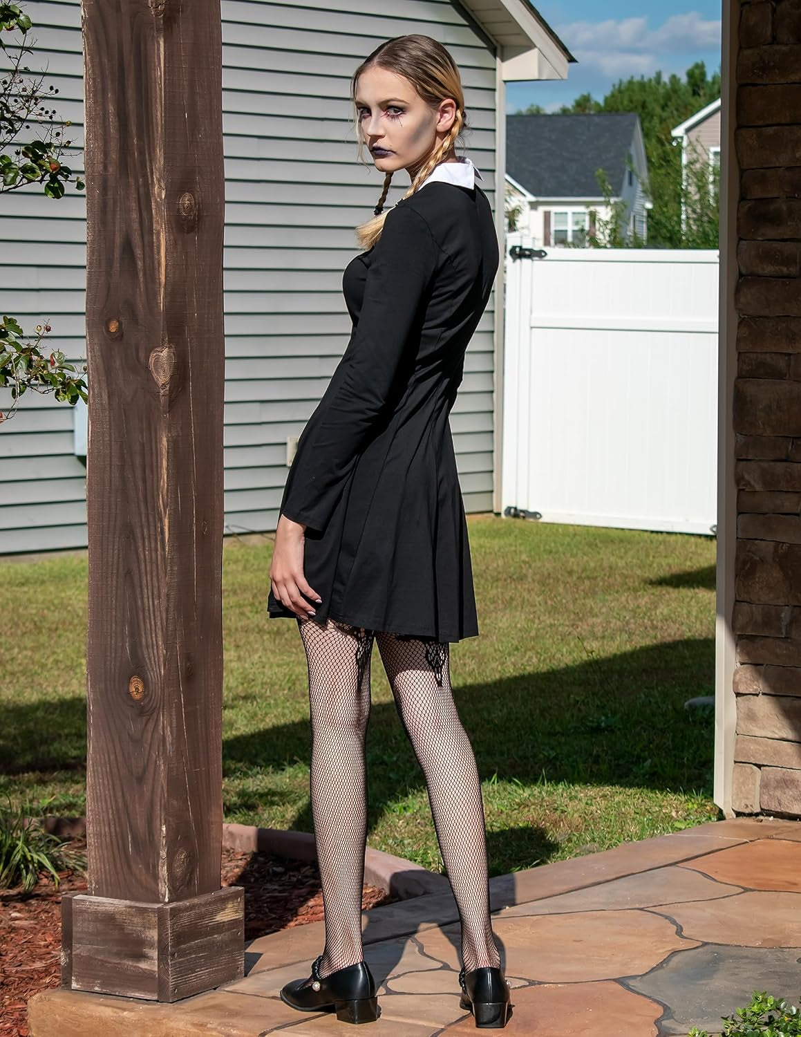 Black women's long sleeve dress with Peter Pan collar, inspired by Wednesday Addams, featuring a classic, gothic style.