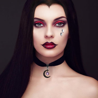 Gothic black velvet moon crystal choker necklace for women, featuring a dark, elegant design with moon-shaped pendant and sparkling crystals.