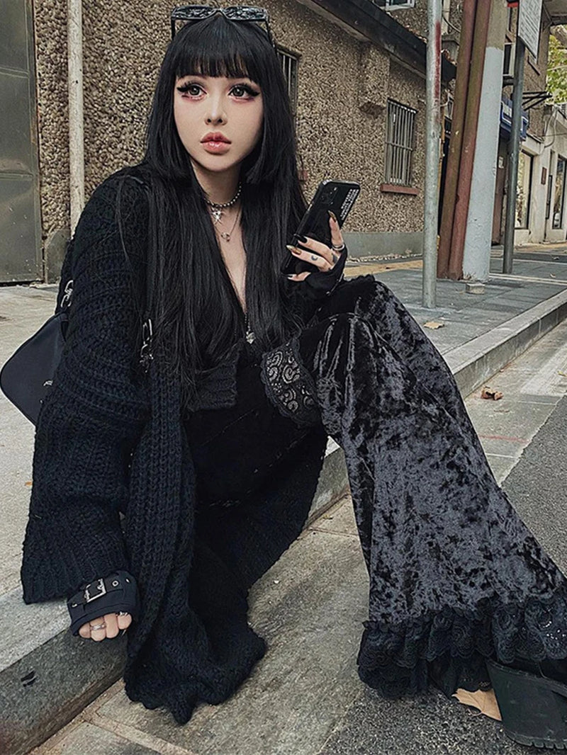 Dark black velvet flare pants with lace patchwork and hollow out details, edgy Harajuku punk gothic style.