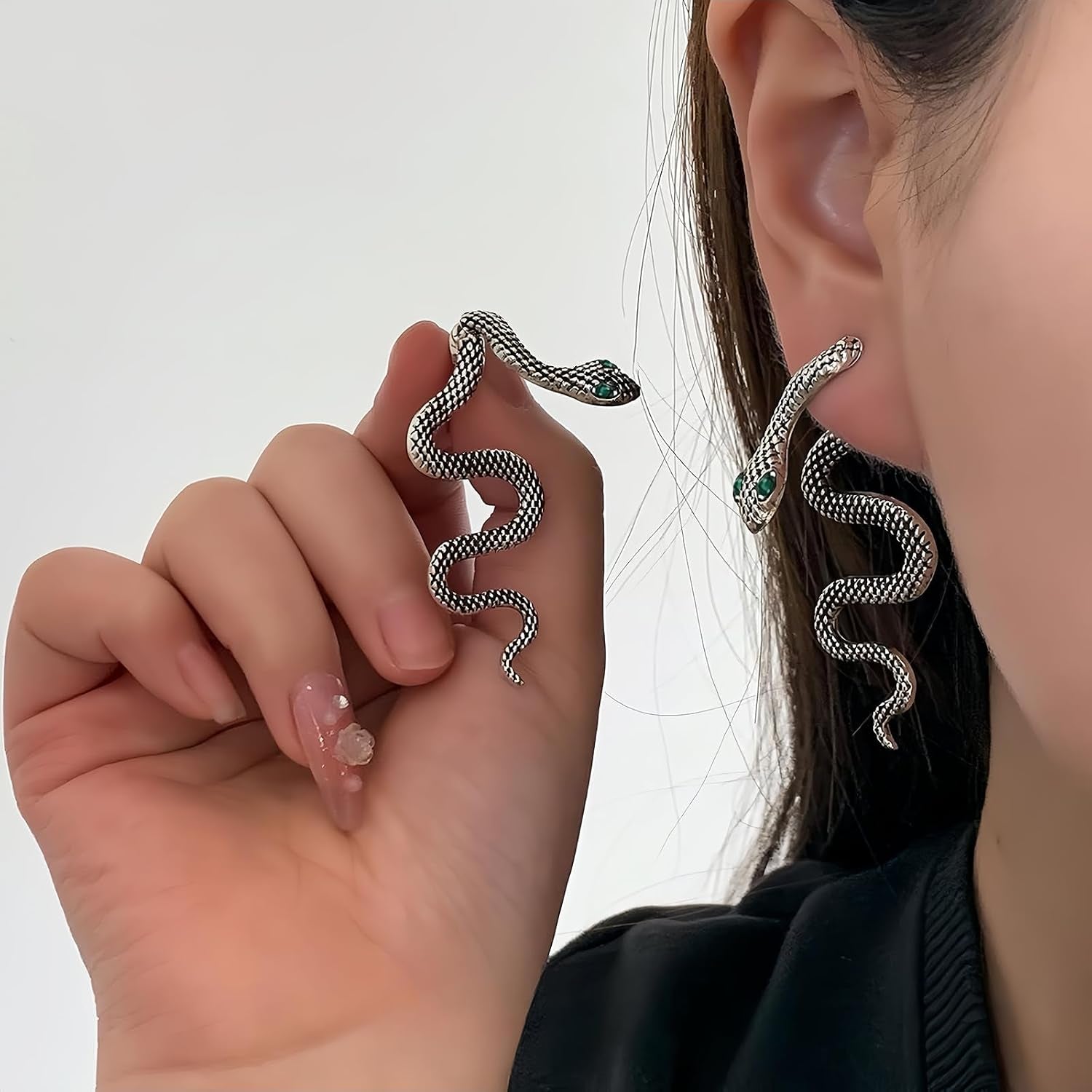 Vintage gothic snake earrings in gold and silver, statement jewelry ideal for Halloween or gothic-inspired fashion.