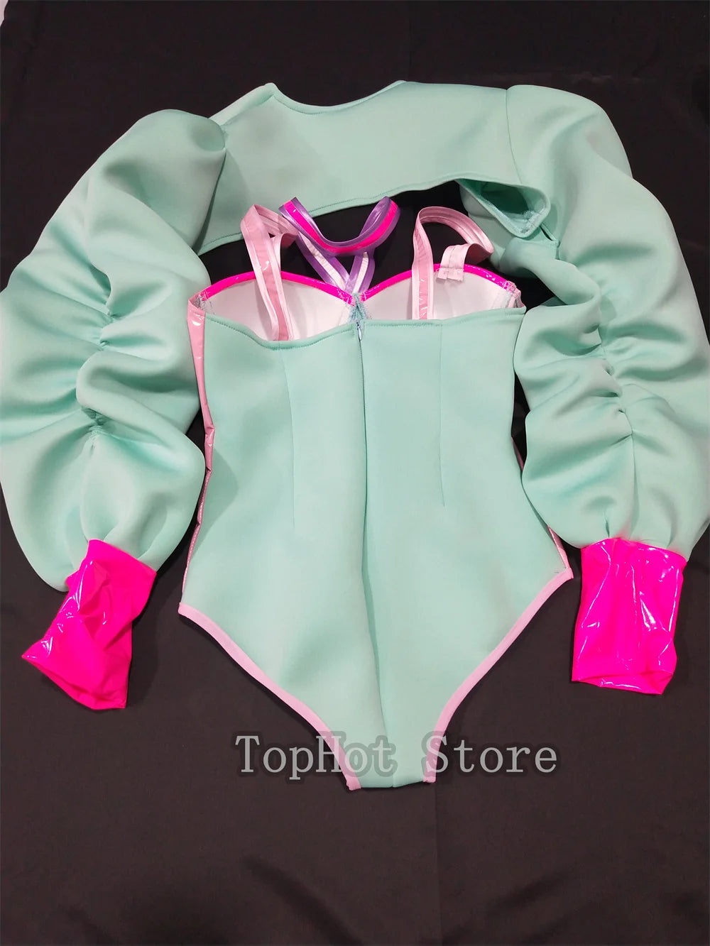 Vibrant Pink and Green Color-Blocked Bodysuit with Bold Bubble Sleeves for Dazzling Drag Performances and Nightclub Nights