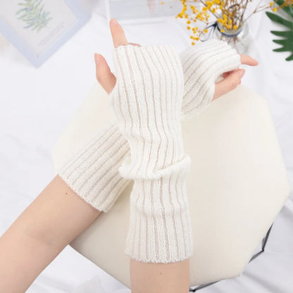 Cozy black women's long fingerless gloves from PressureDen.store, perfect for goth and punk style winter arm sleeves.