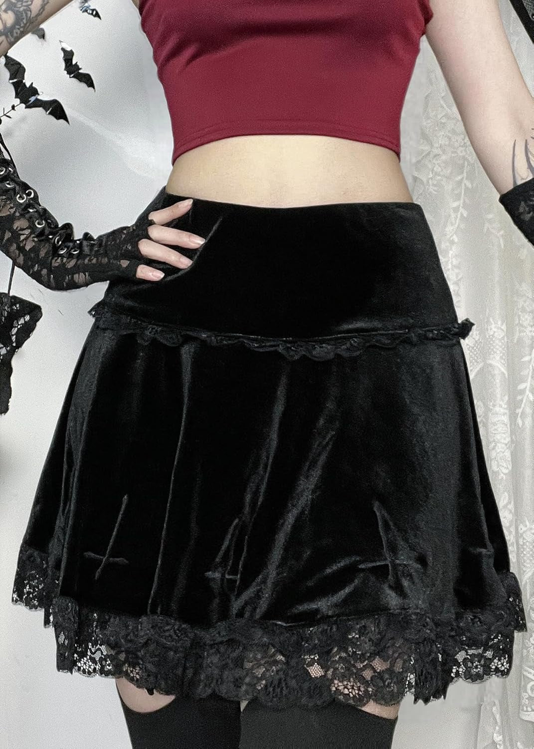 High waist black gothic velvet mini skirt for women, featuring punk grunge emo fashion style with a fitted silhouette.