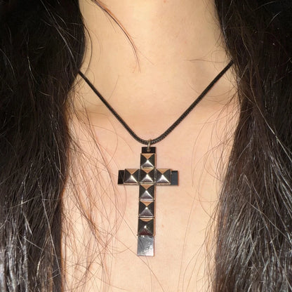 Edgy 90s punk rivet cross pendant necklace for women, grunge rock fashion accessory with metal rivet details.