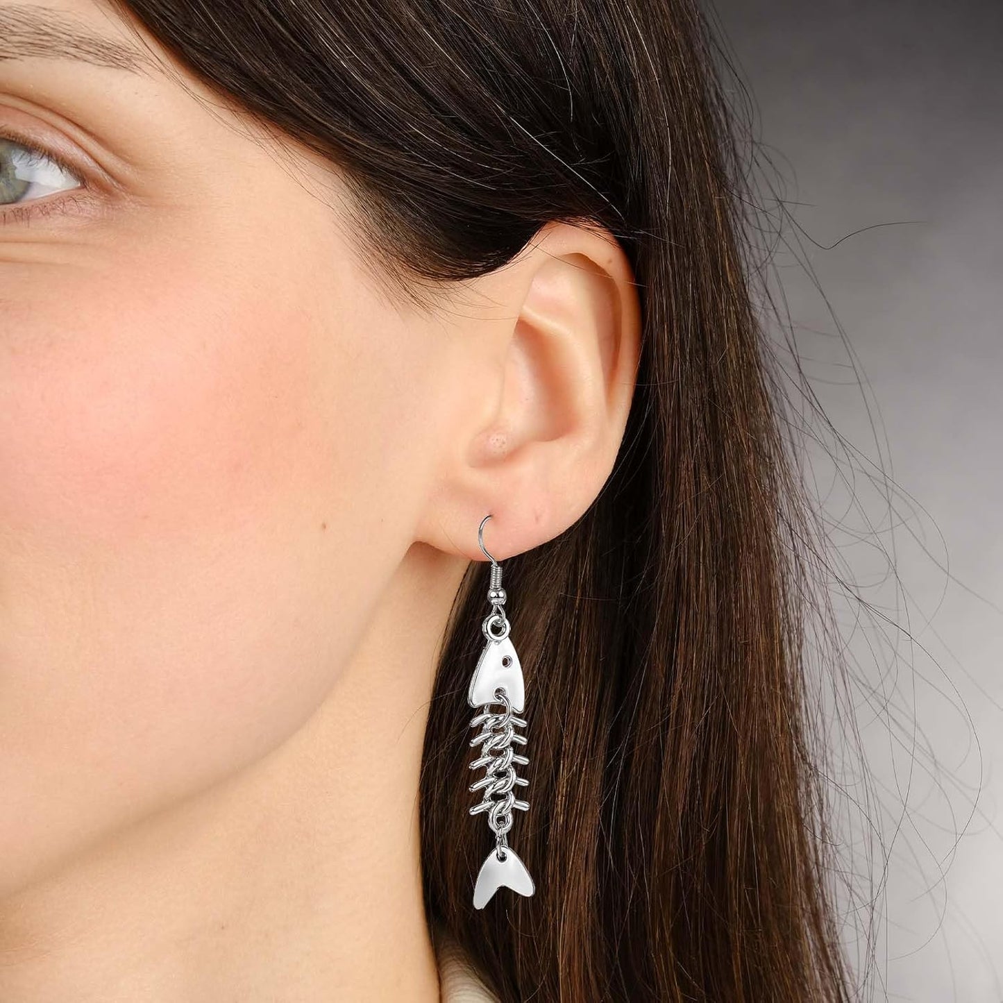 Pair of Yuanchu long fish bone dangle earrings featuring zinc alloy punk goth jewelry style for women.