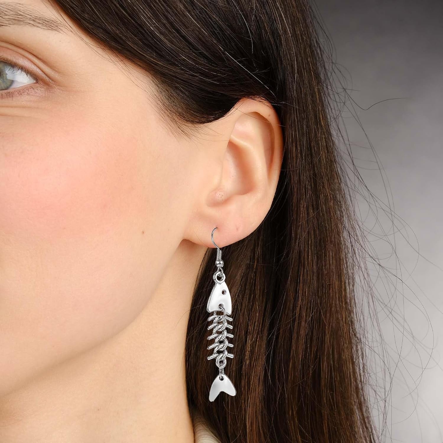 Pair of Yuanchu long fish bone dangle earrings featuring zinc alloy punk goth jewelry style for women.