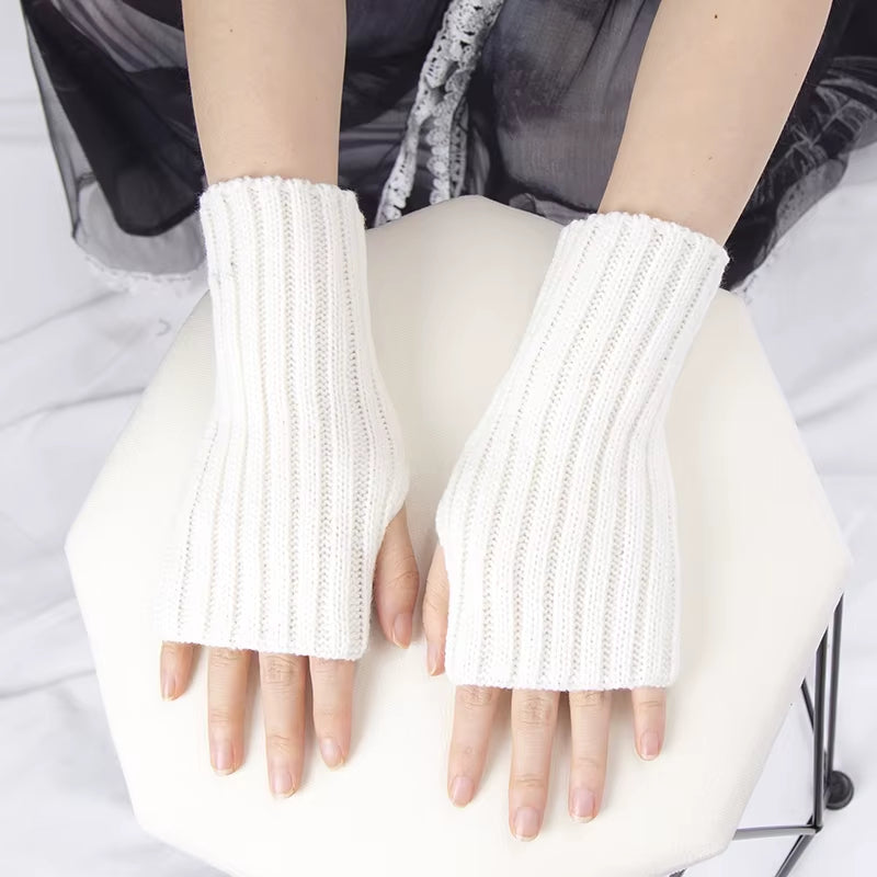 Kawaii crochet fingerless winter gloves for women, goth lolita arm warmers, stylish accessories in black with intricate knit design.