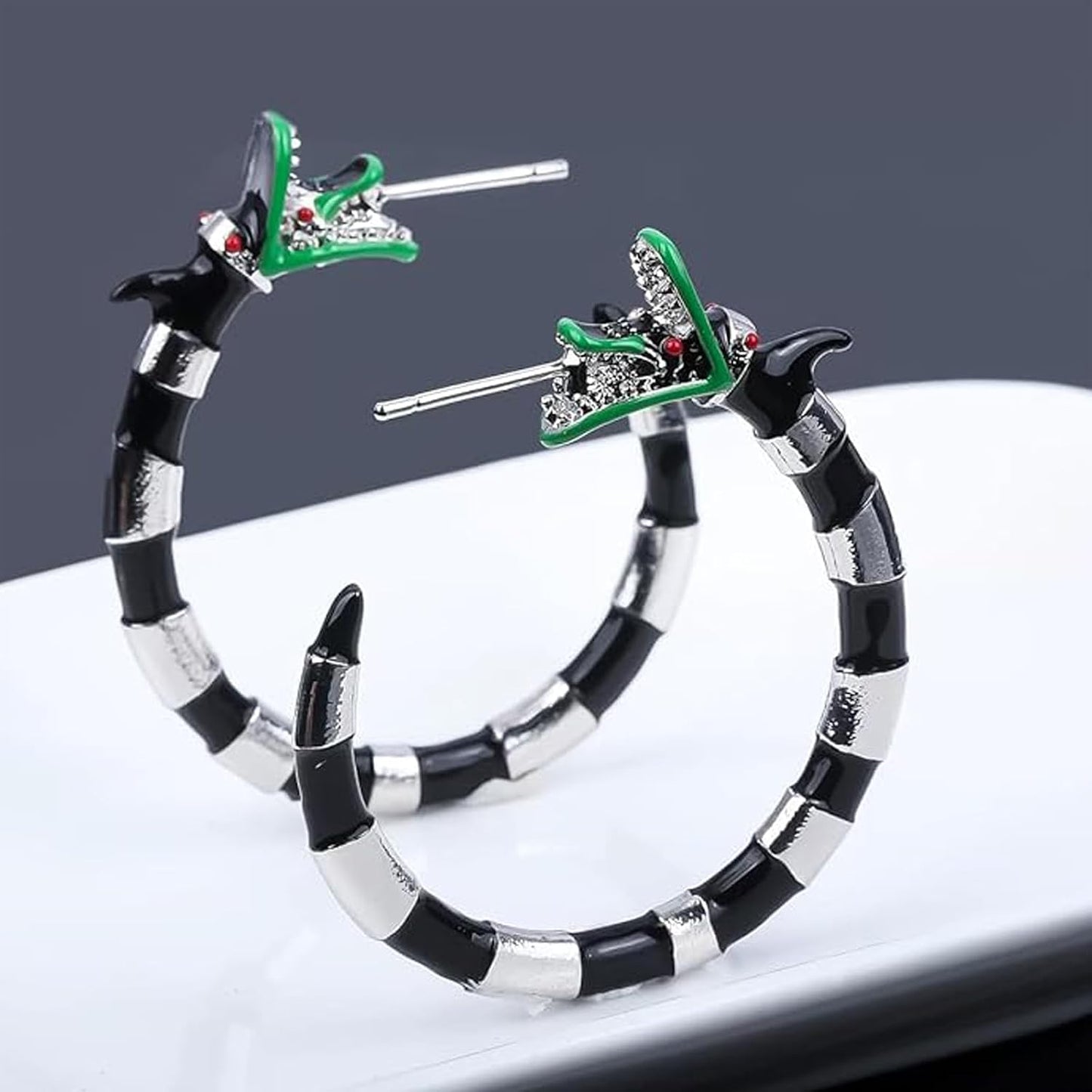 Gothic coral snake earrings by wsycoo featuring spooky enamel sandworm hoops with beetle design, perfect for Halloween and cosplay.
