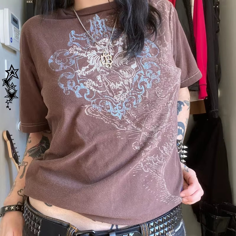 Brown retro Y2K graphic T-shirt by PressureDen.store featuring goth cyber grunge style, short sleeves, and a vintage emo design.