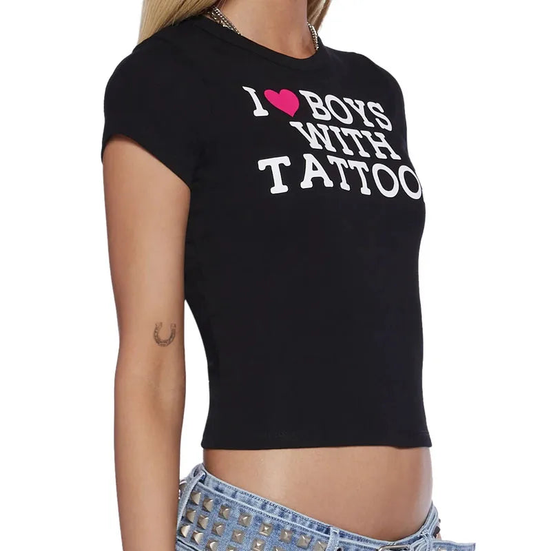 Aesthetic goth graphic crop top featuring 2000s Y2K Harajuku E-Girl style in black with bold print, worn by a model.