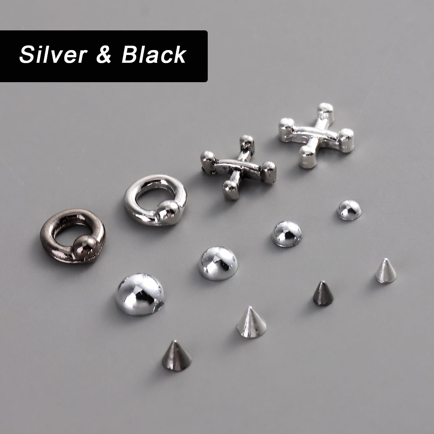 Gothic punk nail charms with 3D triangle and spike designs, black rivets, and silver alloy accessories for edgy Y2K nail art.